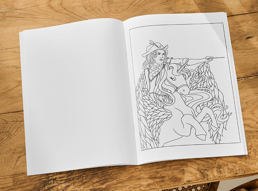 Open page with a lineart of a witch cowboy riding a unicorn