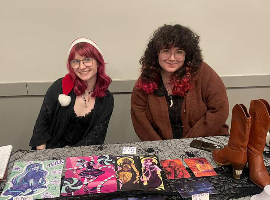 Photo of two Crescent Moon Commodities owners sitting at a table