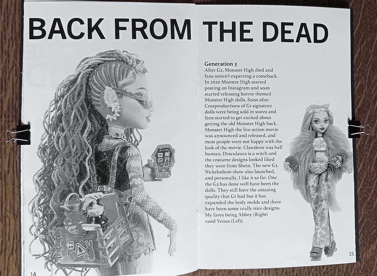 Photograph of Full page spread with text and photos of monster high dolls